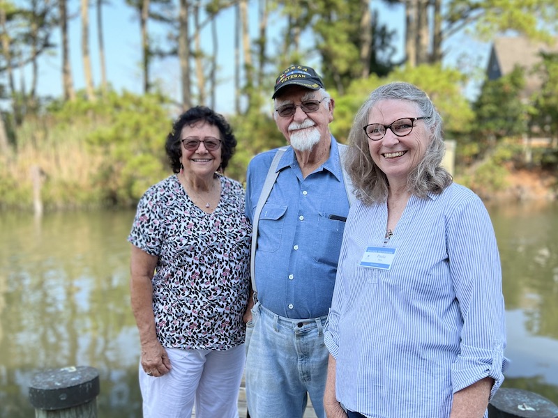A Village Neighbors Volunteer standing with a member couple.